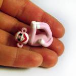 Pink Sock Monkey Pendant Swinging From All Fours..